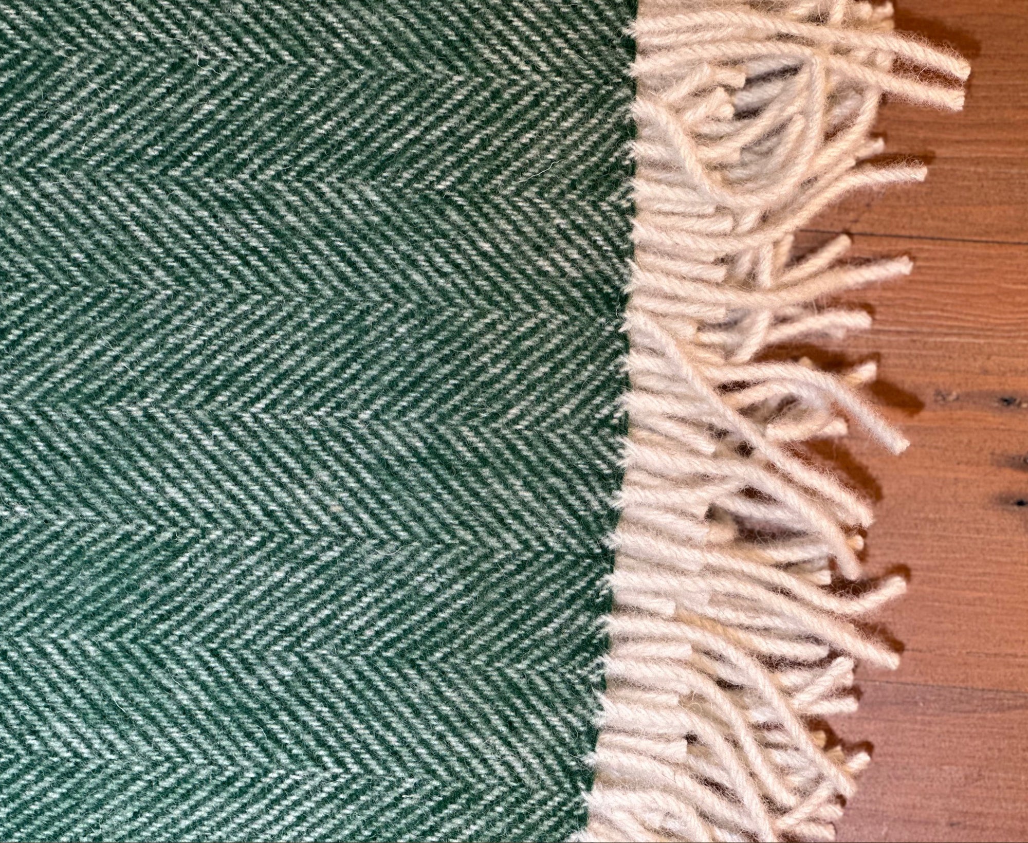 100% Lambswool Herringbone Throw Bottle Green.