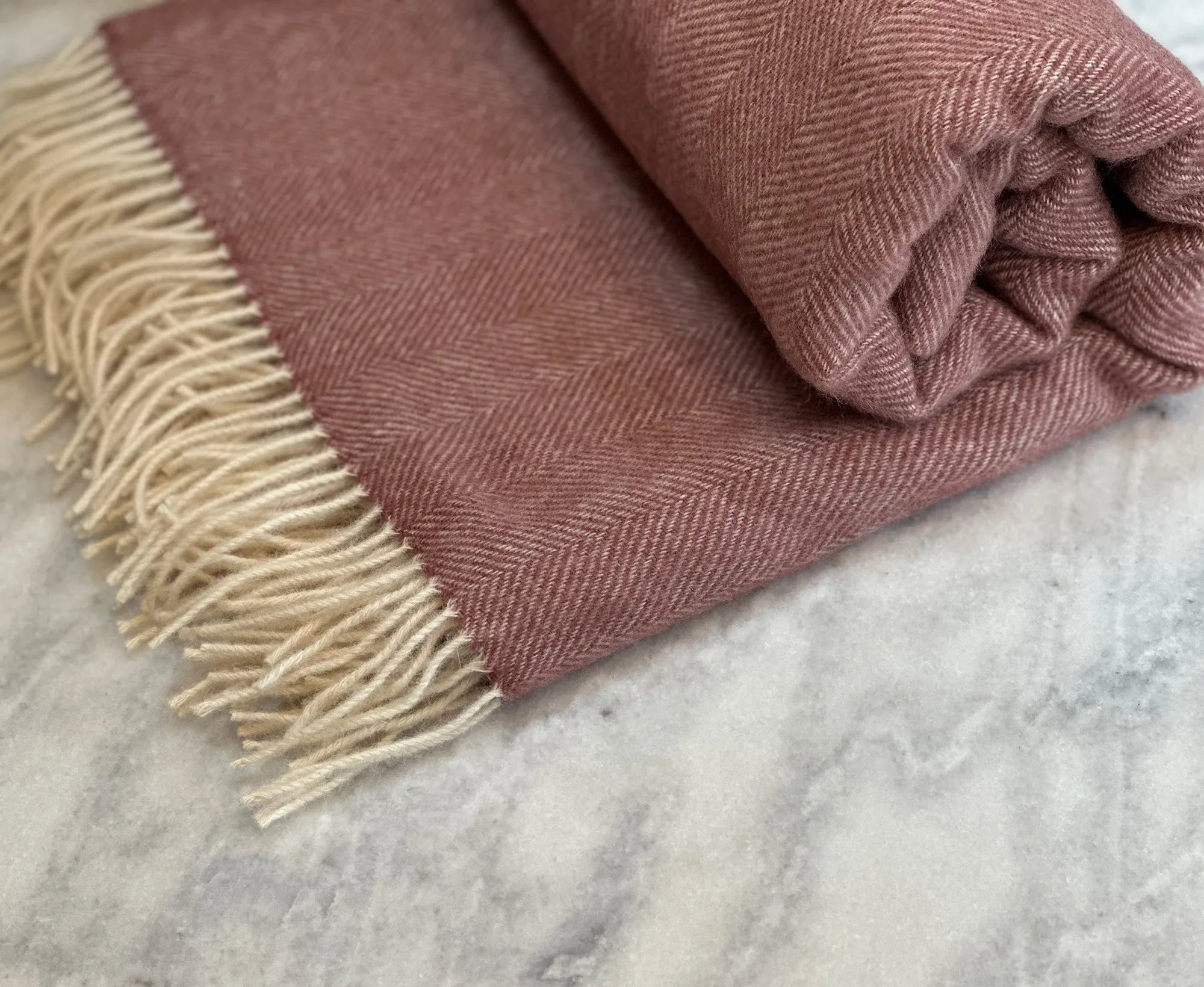100% Lambswool Herringbone Throw Dusky Pink.
