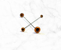 Brown Glass Eyes On Sticks.